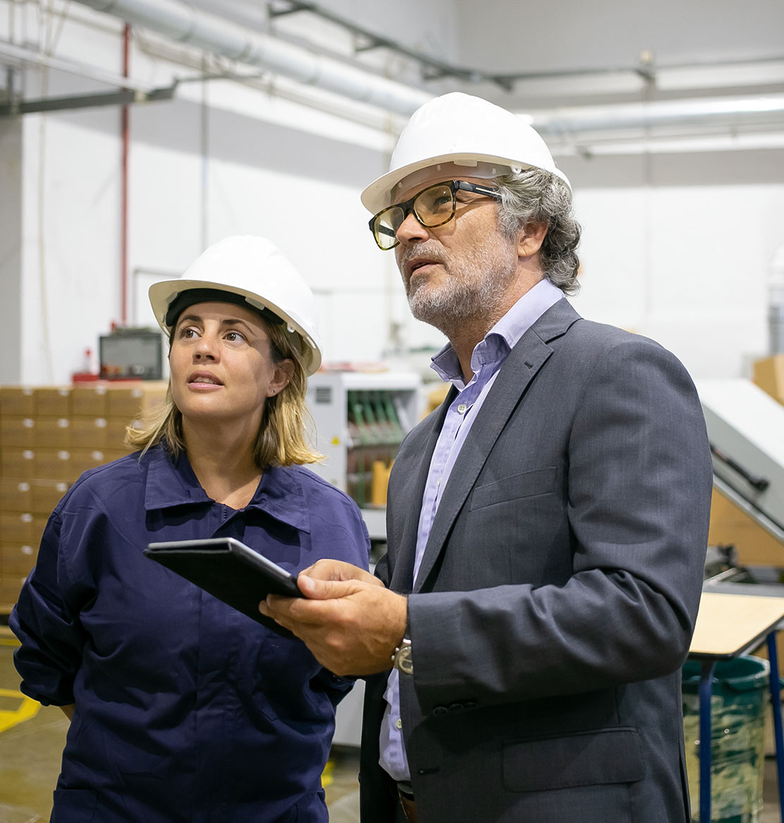 talking-with-female-plant-worker-holding-tablet